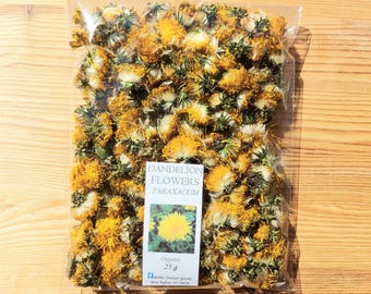 May include: A transparent bag containing dried dandelion flowers. The flowers are yellow and white, with green stems. A white label reads "Dandelion Flowers Taraxacum" with a dandelion image and "Organic 25 g".