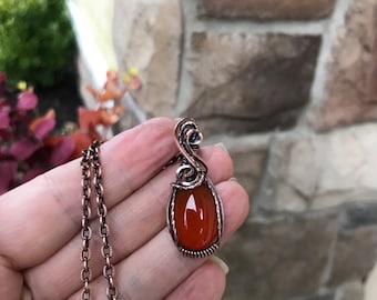 Carnelian wire wrapped pendant, Chakra healing orange crystal necklace. Handmade oxidized copper jewelry