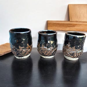 Set of 3 Footed Cup Yunomi Ceramic Art Pottery Teadust Black Bronze Metalluc Carved Wheel Thrown Kurinuki Style Coffee Tea 8 oz