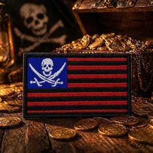 May include: A rectangular pirate flag patch with a blue square featuring a white skull and crossed swords. The flag has red and black horizontal stripes. The patch is surrounded by gold coins, a treasure chest, and a skull.