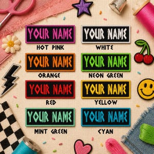 May include: Rectangular embroidered patches in various colors, each with the text "YOUR NAME". Colors include hot pink, white, orange, neon green, red, yellow, mint green, and cyan. Decorative patches and sewing supplies are also visible.