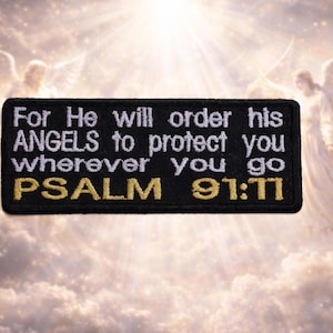 May include: A white ceramic mug with a black handle and the text "But First, Coffee" in a bold, black font. The mug is set against a blurred background, suggesting a cozy setting.