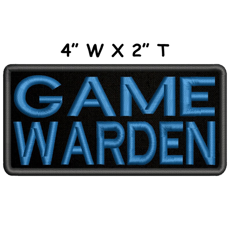 May include: An embroidered patch with black background and blue lettering that reads "GAME WARDEN". The patch is 4 inches wide and 2 inches tall.