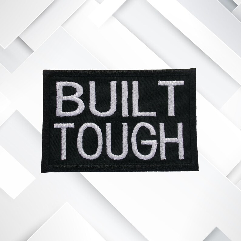 May include: Black embroidered patch with white text that reads "BUILT TOUGH".