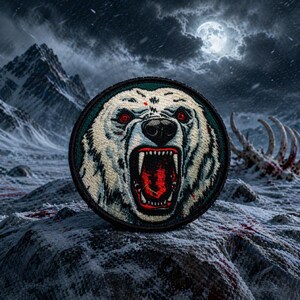 May include: Embroidered patch featuring a snarling polar bear with red eyes and an open mouth, set against a snowy, mountainous backdrop under a full moon. The bear's fur is white, and the patch has a black border.