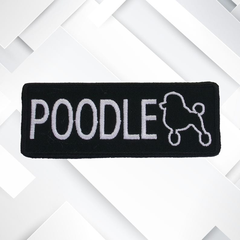 May include: A black rectangular patch featuring the word "POODLE" in white embroidery, accompanied by a white poodle outline. The patch has a black border and is designed for application to fabric.