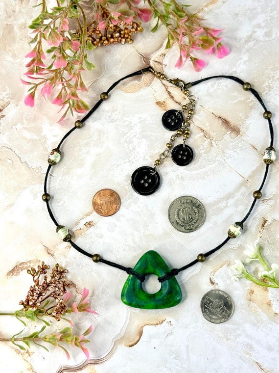 Coraline Looking Stone Pendant Necklace | Faux Verdite Resin, Black Hemp Cord, Button Accents Coraline Looking Stone Pendant Necklace | Faux Verdite Resin, Black Hemp Cord, Button Accents