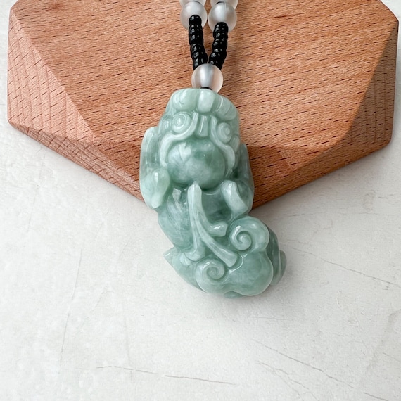 Carved jade dragon pendant sale