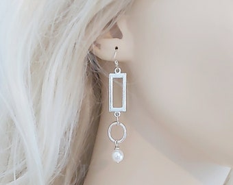 Silver and pearl drop earrings.