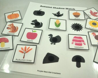 May include: A printable educational game for kids featuring a shadow matching activity with autumn-themed images. The game includes images of a pumpkin, squirrel, apple, mushroom, autumn tree, corn, acorn, sweater, leaf, sunflower, and a turkey.