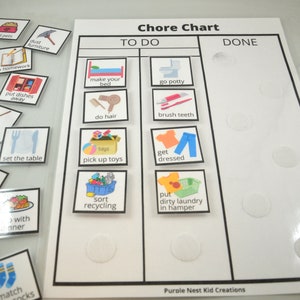 May include: A white chore chart with two columns labelled "To Do" and "Done".  The chart has pictures of common chores for children, such as making their bed, brushing their teeth, and picking up toys.  There are white velcro dots on the chart.