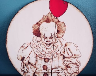 Hand burned Pennywise clown wood burning on birchwood round, IT, pyrography