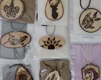 Handmade wood burning necklaces