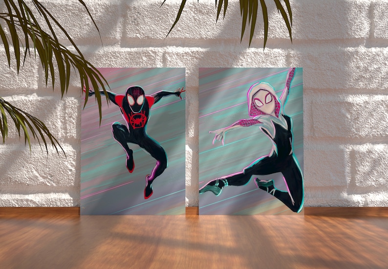 May include: Two digital art prints featuring Spider-Man characters. The print on the left shows Miles Morales, Spider-Man, in a black and red suit with a red spider symbol on his chest. The print on the right shows Gwen Stacy, Spider-Gwen, in a white and black suit with a white spider symbol on her chest. Both characters are in mid-air, with a colorful, abstract background.