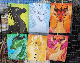 May include: Six colorful illustrations of dragons, each with a different color scheme and expression. The dragons are depicted in a cartoon style with large eyes and expressive features. The illustrations are printed on white card stock and are perfect for fans of fantasy and dragons.