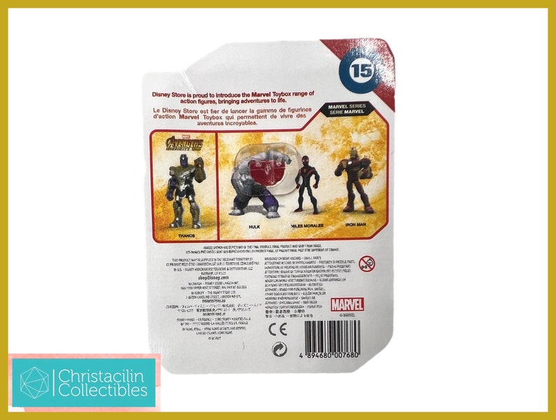 May include: Marvel Toybox action figures, featuring Thanos, Hulk, Miles Morales, and Iron Man. The packaging includes text in English and French, with the Marvel logo and a Disney Store label. The figures are part of Marvel Series 15.