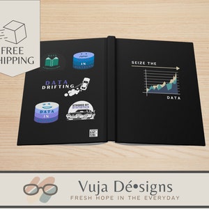 May include: A black notebook with a blue and green graph on the right side and several stickers on the left side. The stickers feature data-related puns and graphics. The text on the right side reads "Seize the Data". The text on the left side reads "Data Drifting", "Data in Distress", "Steered by Statistics", and "Data in Motion".