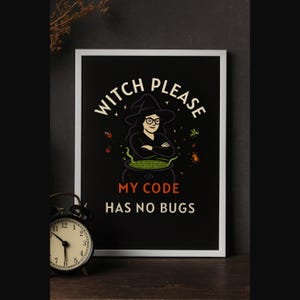 May include: A framed black poster with the text "WITCH PLEASE MY CODE HAS NO BUGS" and an illustration of a witch in a cauldron. A black alarm clock sits in front of the poster.