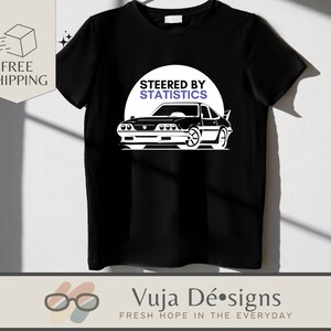 May include: Black t-shirt with a white graphic of a car and the text "Steered by Statistics".