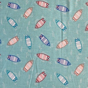 May include: A teal fabric featuring a repeating pattern of boats on water. The boats are in red, blue, and tan, each with a white life preserver. White wavy lines suggest water movement.
