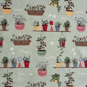 May include: A light green fabric featuring a repeating pattern of potted herbs and plants. The design includes illustrations of strawberries, basil, chives, rosemary, parsley, and thyme in various pots, with small white flowers and plant labels.