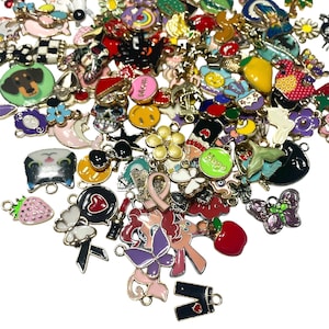 May include: A large assortment of colourful enamel charms with various designs, including animals, hearts, flowers, and words like "Hope". The charms are made of metal and have a gold-tone finish.
