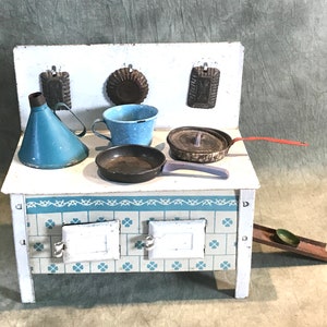 Cute children&#39;s stove  with pans