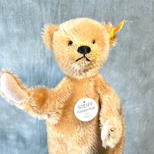 Marioneta de mano Steiff Osito de peluche con botón