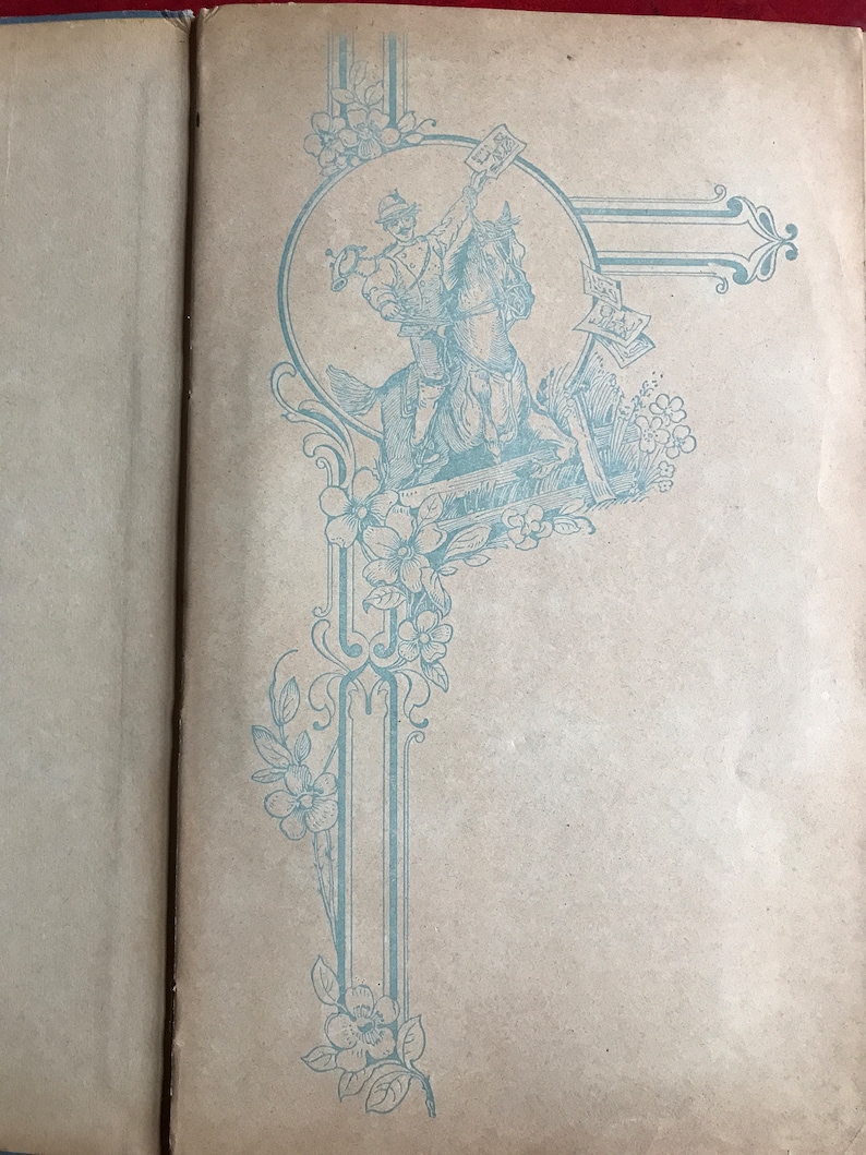 May include: A vintage book with a blue and white decorative design on the cover. The design features a soldier riding a horse and holding a flag.