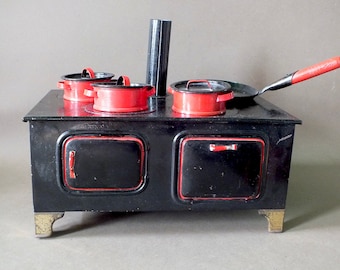 Antique children's stove 1930 with pans