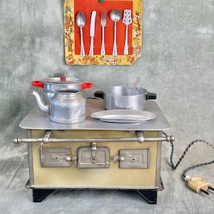 Antique children&#39;s electric stove from
