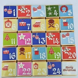 May include: A Christmas advent calendar with 24 chocolate squares. Each wrapper is a different colour and features a festive design and a number from 1 to 24. The final wrapper says "Merry Christmas".