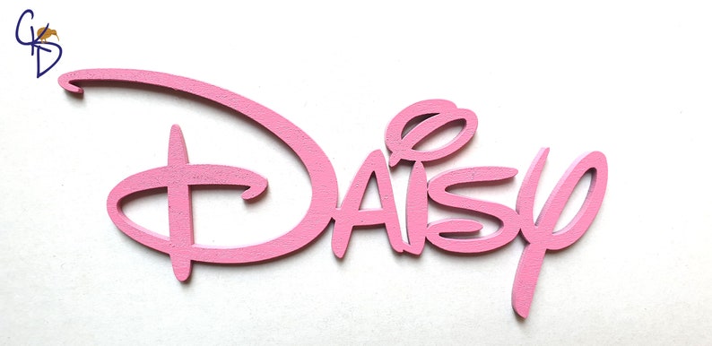 May include: Pink wooden cutout of the name "Daisy" in a stylised font reminiscent of the Disney logo.