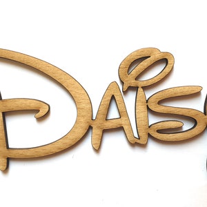 May include: Wooden cutout of the word "Daisy" in a stylised font, similar to the Disney logo.
