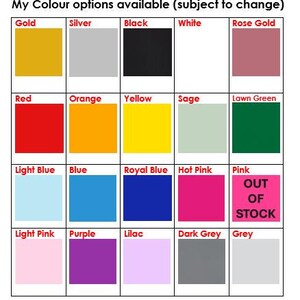 May include: A chart displaying 20 colour options for a product. The colours are arranged in a grid of four rows and five columns. The colours include gold, silver, black, white, rose gold, red, orange, yellow, sage, lawn green, light blue, blue, royal blue, hot pink, pink, light pink, purple, lilac, dark grey, and grey. The words "OUT OF STOCK" are written in red letters on a white background in the square for the colour pink.