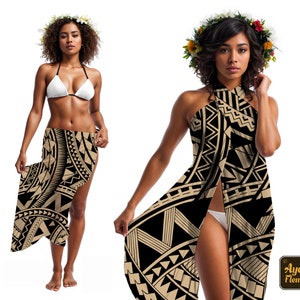 May include: Two women wearing black and gold patterned sarongs. One woman is wearing a white bikini top and the other is wearing a halter top style sarong. Both women are wearing flower crowns.
