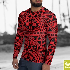 May include: A red and black long-sleeved shirt with a geometric pattern. The pattern is reminiscent of Polynesian tribal art.