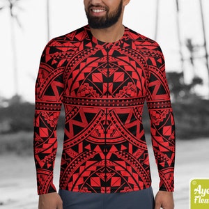 May include: Red and black long-sleeved shirt with a geometric pattern. The pattern is reminiscent of Polynesian tribal art.