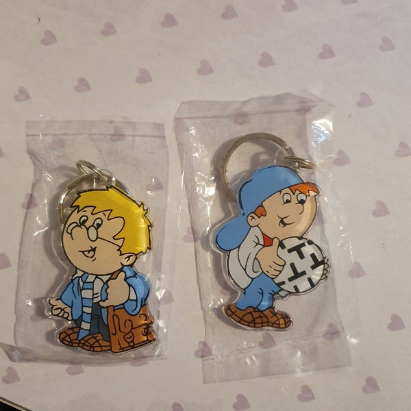 Two Vintage Tetley Tea Folk Keyrings still sealed 1995