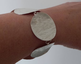 Handmade silver bracelet, large hammered disc bracelet, contemporary silver, made in the UK, gifts to send by post