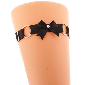 Black thigh adjustable garter metal o ring with black satin bow with a pearl, elastic garter strap on the leg handmade all sizes