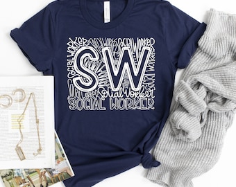 May include: Navy blue t-shirt with a white graphic design that says "SW" with the word "Social Worker" repeated around the letters.