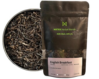May include: A black pouch with a white label that reads "English Breakfast" black tea. The label also says "Dried Black Tea Leaves" and "Caffeine Level: Medium". The pouch is sitting on a white background.
