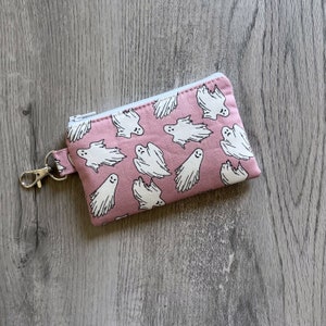 Mini llavero fantasma con cremallera, billetera pequeña rosa para Halloween, monedero espeluznante, bolsa con clip giratorio, tarjetero pequeño que brilla en la oscuridad