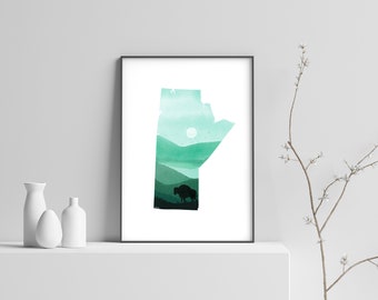 May include: A framed print of the outline of the Canadian province of Manitoba filled with a watercolor landscape of green hills, a lake, and a silhouette of a bison.