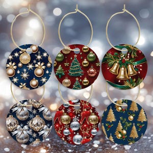 May include: Six Christmas-themed wine charms with gold hoops. The charms feature festive designs like snowflakes, ornaments, Christmas trees, bells, and reindeer. The color palette includes gold, silver, red, and navy blue, creating a holiday atmosphere.