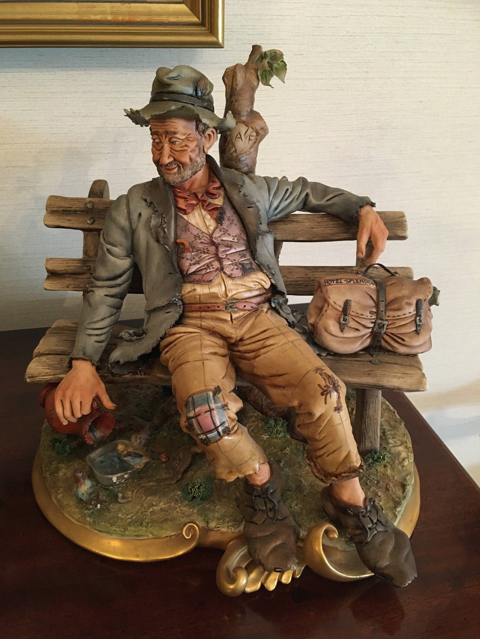 capodimonte tramp on bench with dog