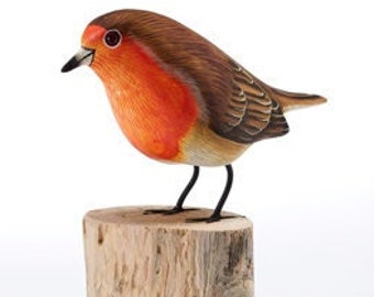 Exquisite handmade wooden robin perched on a log