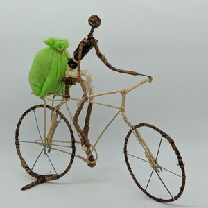 Model bike, cyclist with cloth bag