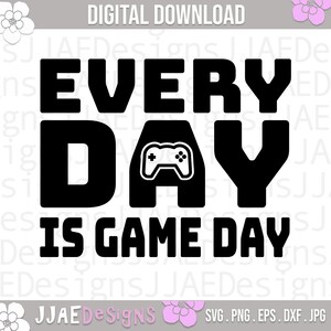 May include: Black and white graphic design with the text "Every Day Is Game Day" and a stylized image of a video game controller.